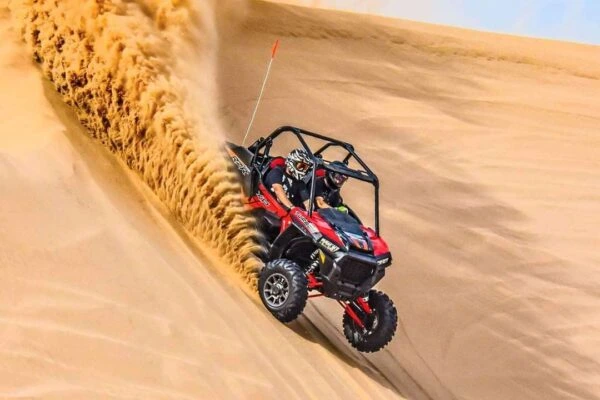 Tourists enjoying Dubai desert Safari packages