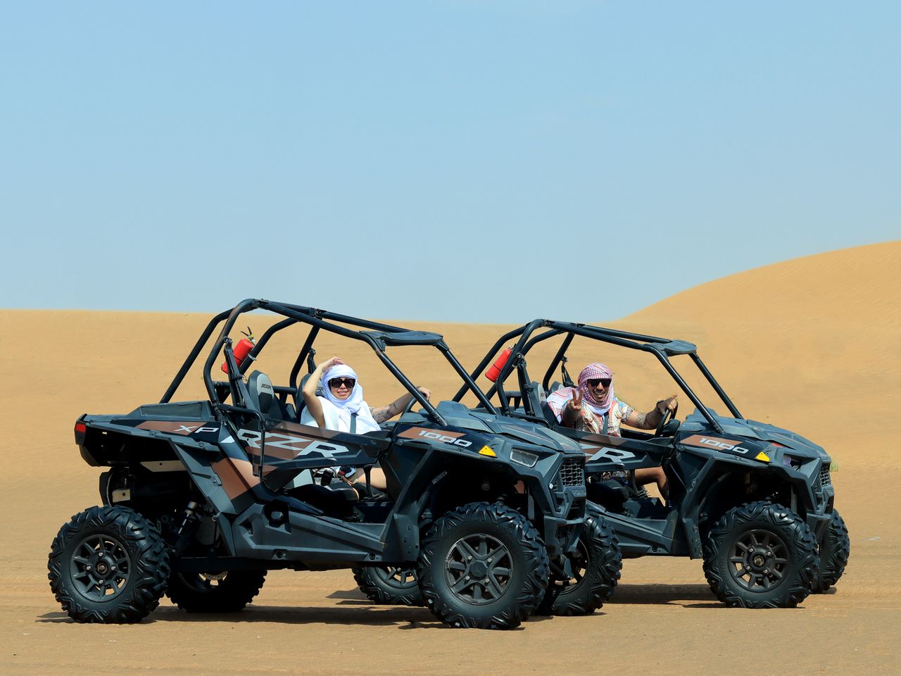 Experience a thrilling desert adventure with off-road buggies in Dubai's expansive sands.